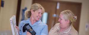Nursing staff scanning assets with mobile device