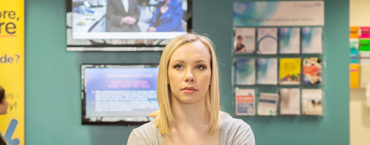 Woman sitting in medical waiting room