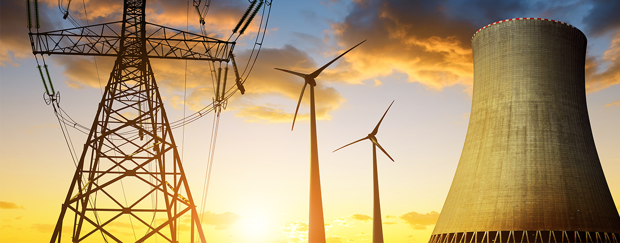 Electicity pilons wind turbines and cooling tower