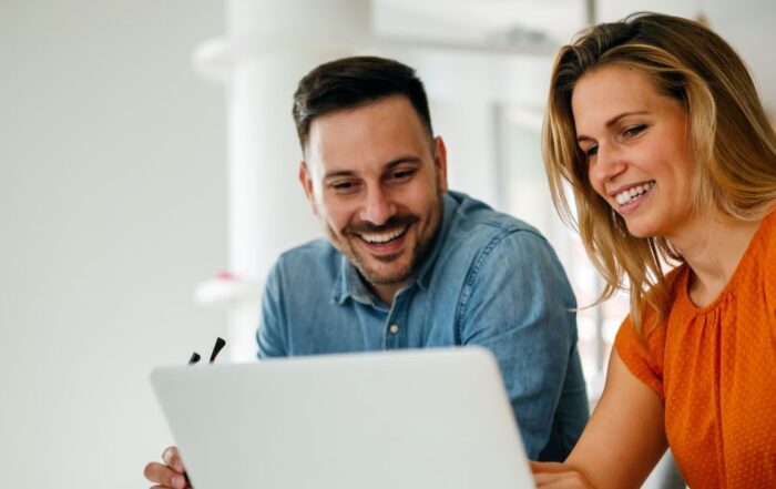 Idox_CasparLaw_Male_and_Female_at_laptop
