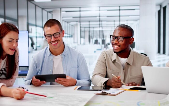 Four people collaborating on a community services platform