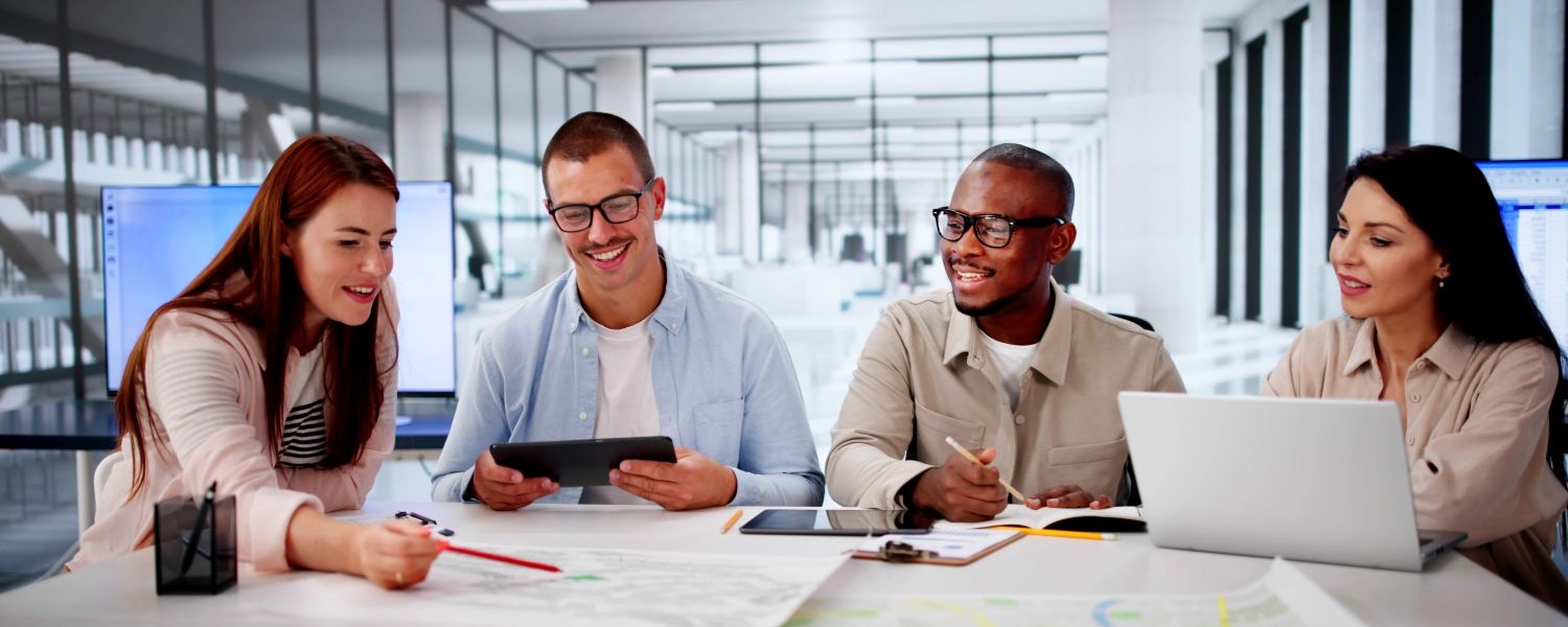 Four people collaborating on a community services platform